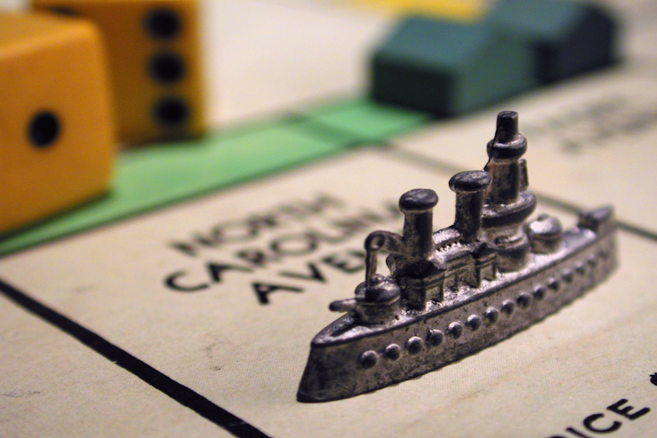 Monopoly ship piece representing teaching history through games